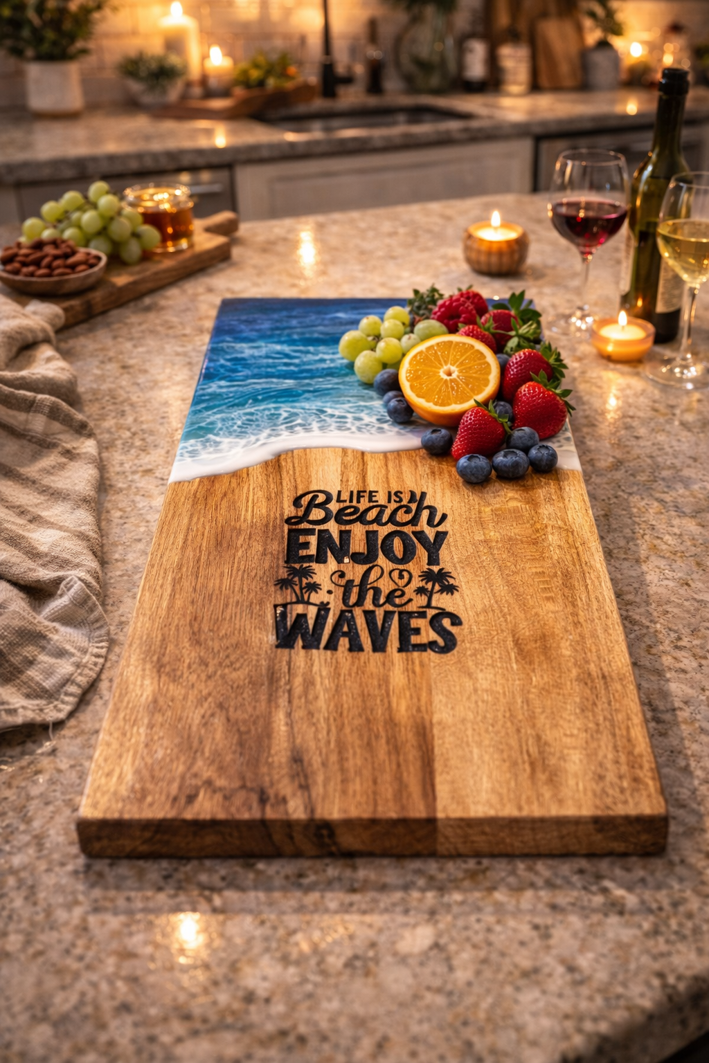 Wooden cutting board with 'Life is Beach, Enjoy the Waves' text on a kitchen counter with fruit and wine.